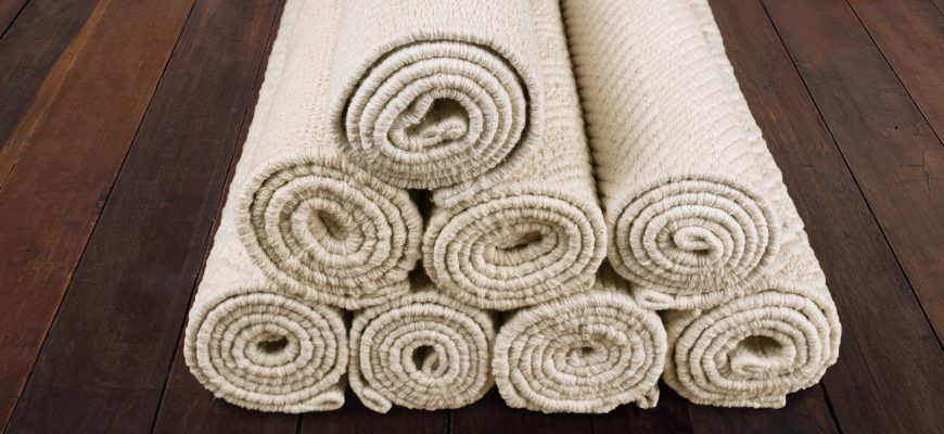 Organic cotton flatweave rolls in an ordered pile