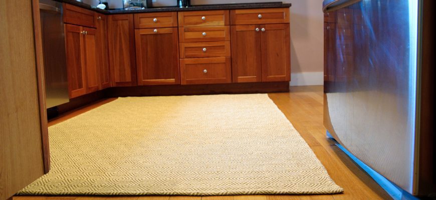 New Ashford taupe yellow 5x8 eco cotton flatweave rug on a kitchen floor, slider size
