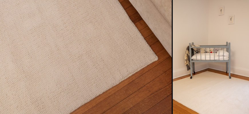 Organic cotton loom-hooked rug shown with a baby crib