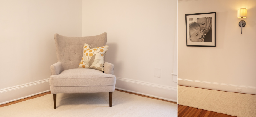 Organic flatweave rug with a chair and a throw pillow with an organic cotton runner in a hallway with a picture of a mother and child on the wall