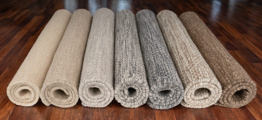 7 rolled rugs, all of them Undyed natural heathered wool, alternate shot