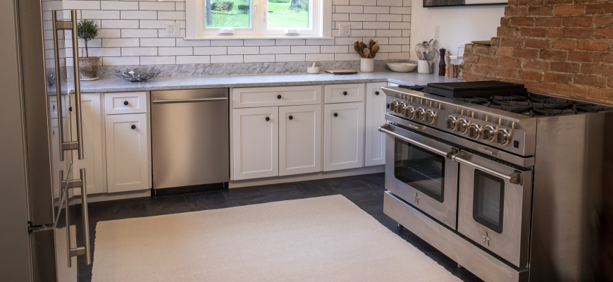 Zigzag organic cotton thick woven rug on the stone floor of a kitchen